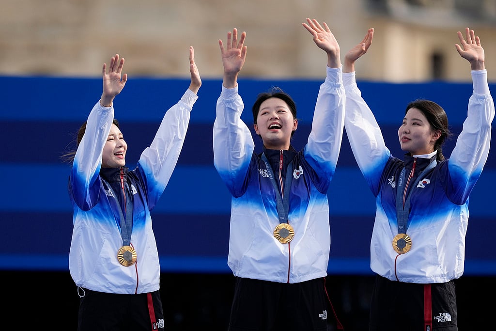 Gold medal winners, South Korea's Jeon Hun-young, left, Lim Si-hyeon, center, Nam Su-hyeon, right, celebrate during women's team medal ceremony at the 2024 Summer Olympics, Sunday, July 28, 2024, in Paris, France. - AP/Rebecca Blackwell