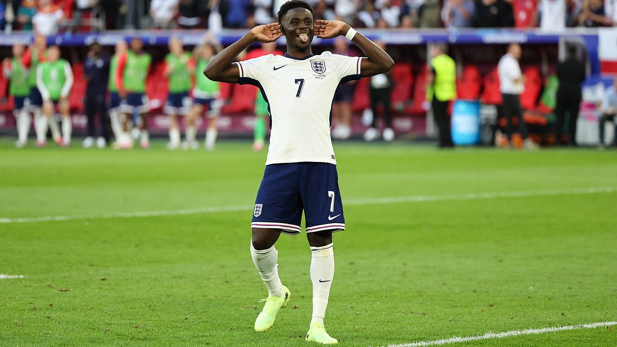 Bukayo Saka celebrates his spot-kick strike on Saturday. - null