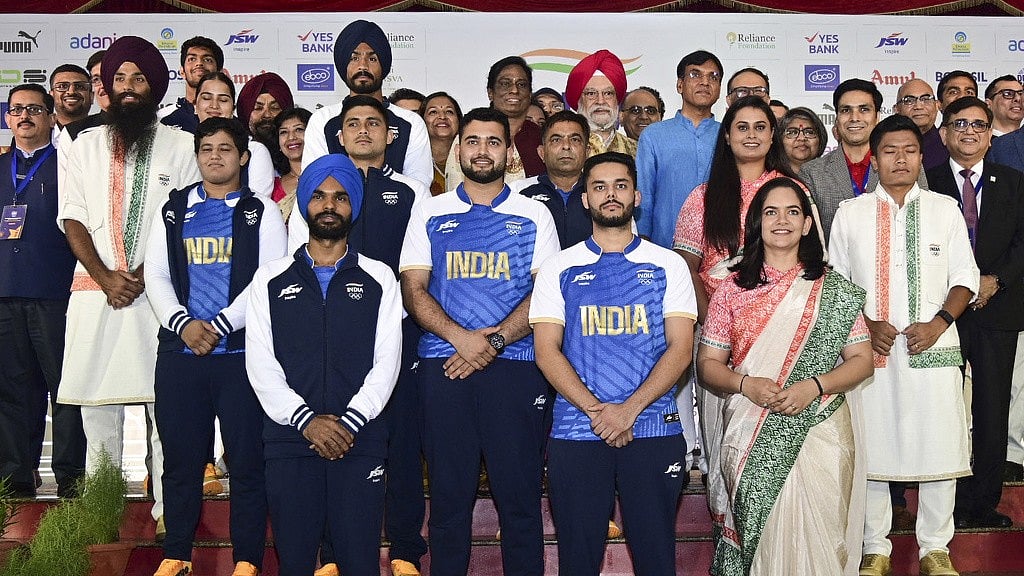 Athletes model India's ceremonial and playing uniforms for Paris Olympic Games 2024. - Photo: Press Information Bureau via AP