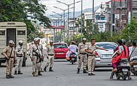  (Photo by Biplov Bhuyan/SOPA Images/LightRocket) : Manipur police officers check commuters during a curfew. Tensions are running high since ethnic clashes erupted last May following a rally organised by the All Tribal Students Union (ATSU) to protest and demand the inclusion of the Meiteis in the Scheduled Tribes (STs) list.