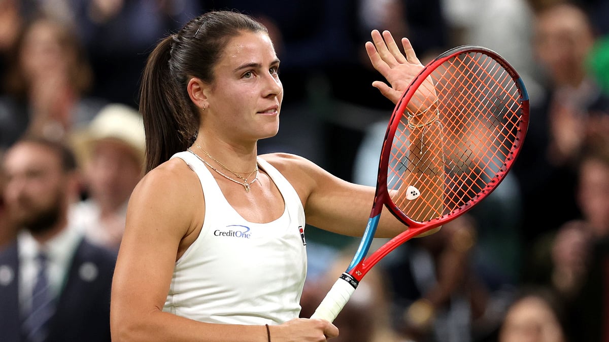 Emma Navarro celebrates after converting her third match point