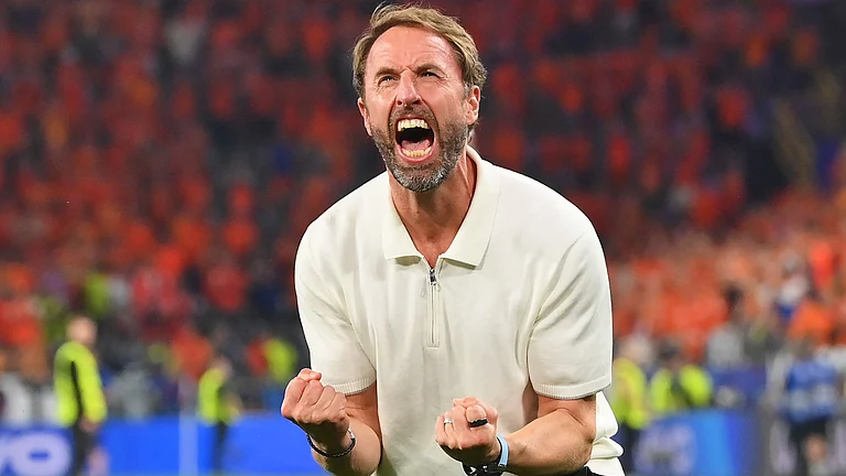Southgate celebrates with the England fans - null