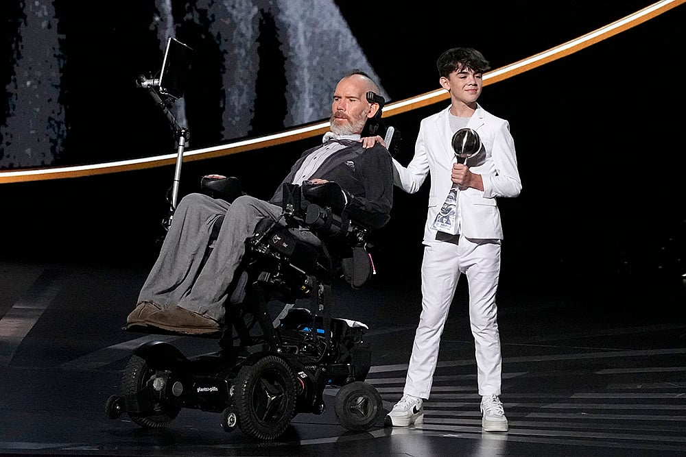 2024 ESPY awards: Steve Gleason, left, recieves the Arthur Ashe Award for Courage