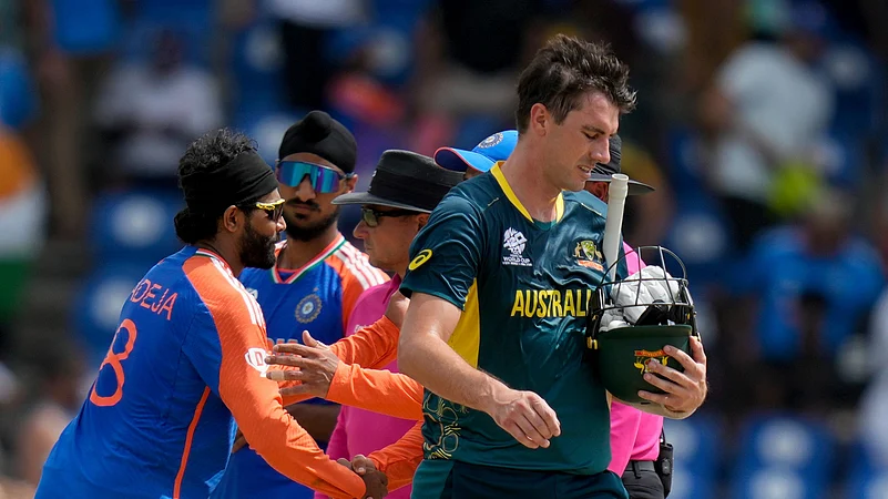 Australias Pat Cummins walks off the field after his side lost by 24 runs against India in an ICC Mens T20 World Cup cricket match. AP Photo