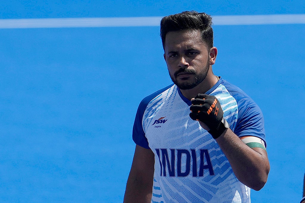 AP/Anjum Naveed : India's Harmanpreet Singh, center, celebrates after scoring a goal during the men's field hockey match between India and Argentina at the Yves-du-Manoir Stadium, at the 2024 Summer Olympics, Monday, July 29, 2024, in Colombes, France.