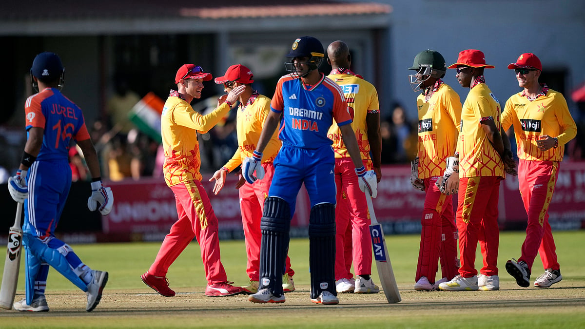 Zimbabwe players celebrate a wicket during the T20 cricket match against India at Harare Sports club. AP Photo