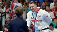 AP/Matthias Schrader : Britain's Princess Anne, left, congratulates Adam Peaty, of Britain, after winning the silver medal in the men's 100-meter breaststroke final at the 2024 Summer Olympics in Nanterre, France.