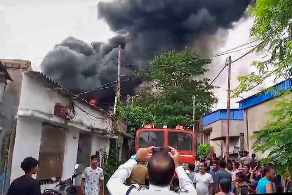 Smoke billows after a fire at a motor oil factory
