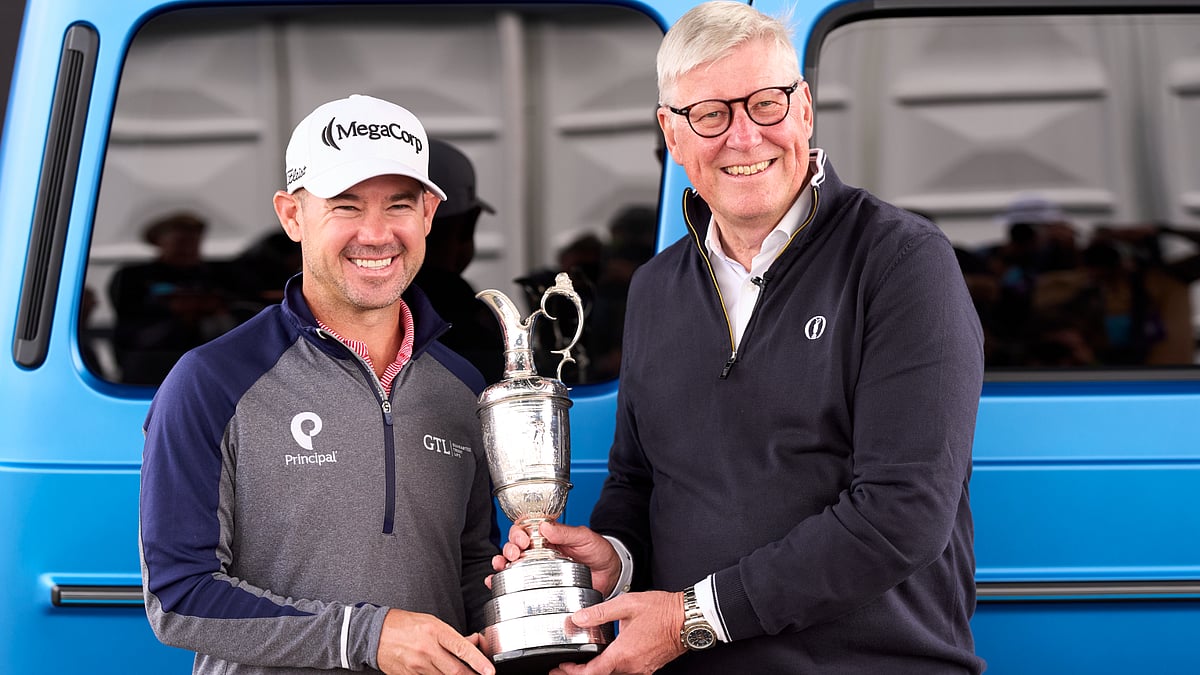 Brian Harman (L) hands back the Claret Jug at Royal Troon on Monday.
