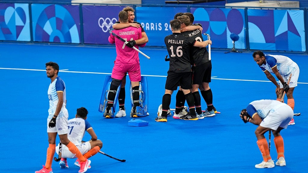 Photo: AP/Aijaz Rahi : Indian players are dejected, while Germany celebrate their win in the Paris Olympics semi-final on Tuesday (August 6).