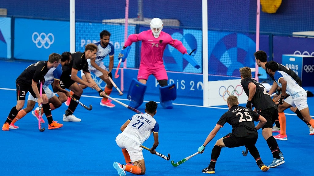 AP/Aijaz Rahi : Shamsher Singh (centre) makes a last attempt at the German goal before India lose the semi-final hockey match at the Paris Olympics on Tuesday (August 6). 
