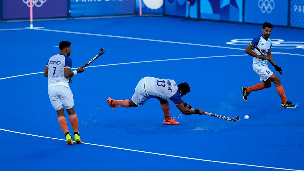 Photo: AP/Aijaz Rahi : India's Harmanpreet Singh, centre, attempts to score from a penalty corder during the semi-final against Germany at the Paris Olympics on Tuesday (August 6).