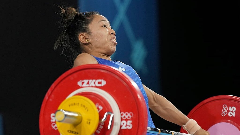 AP/Kin Cheung : Mirabai Chanu Saikhom of India competes during the women's 49kg weightlifting event at the 2024 Summer Olympics, Wednesday, Aug. 7, 2024, in Paris, France.