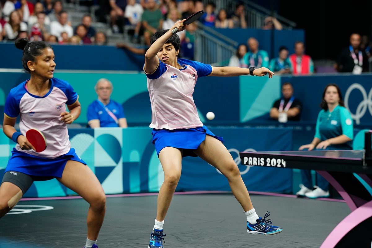 India's Archana Girish Kamath, right, and Sreeja Akula play against Romania's Adina Diaconu and Elizabeta Samara during a women's teams round of 16 table tennis match at the 2024 Summer Olympics, Monday, Aug. 5, 2024, in Paris, France.

 -  (AP Photo/Petros Giannakouris)
