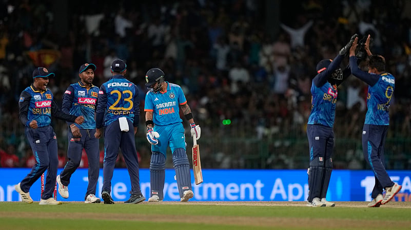 Virat Kohli leaves the ground after losing his wicket. AP Photo