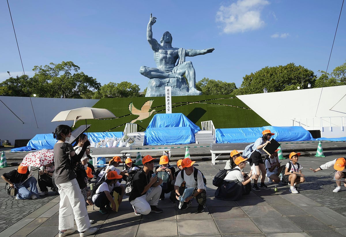 Peace Park visitors crouch after earthquake alert on Thursday | 
