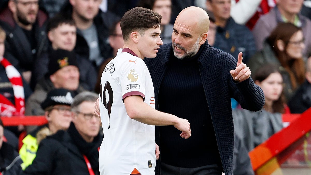 Julian Alvarez and Pep Guardiola - null