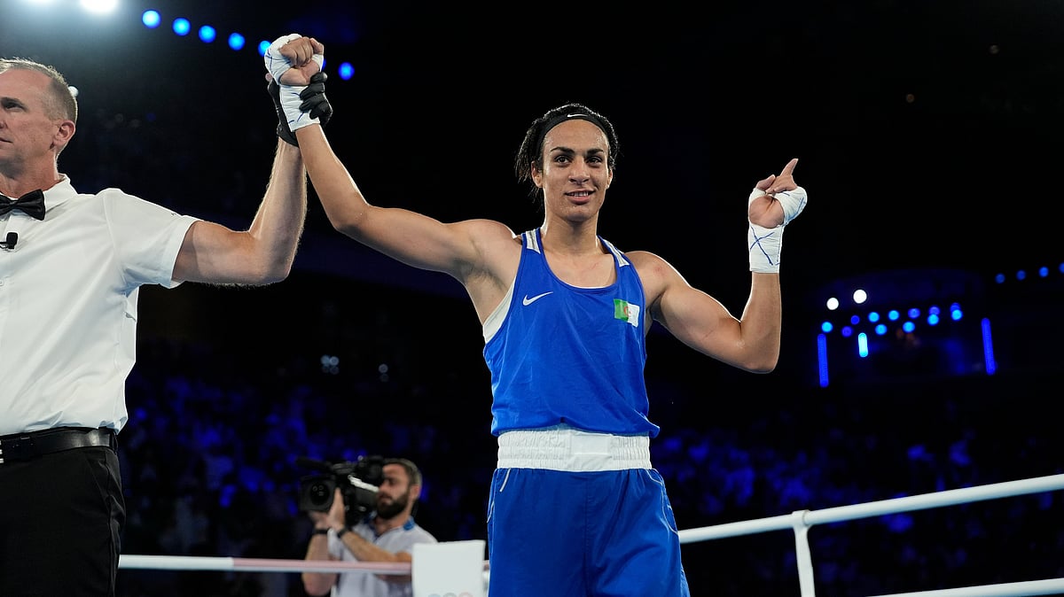  (AP Photo/John Locher) : Algeria's Imane Khelif celebrates after defeating Thailand's Janjaem Suwannapheng in their women's 66 kg semifinal boxing match at the 2024 Summer Olympics, Tuesday, Aug. 6, 2024, in Paris, France.
