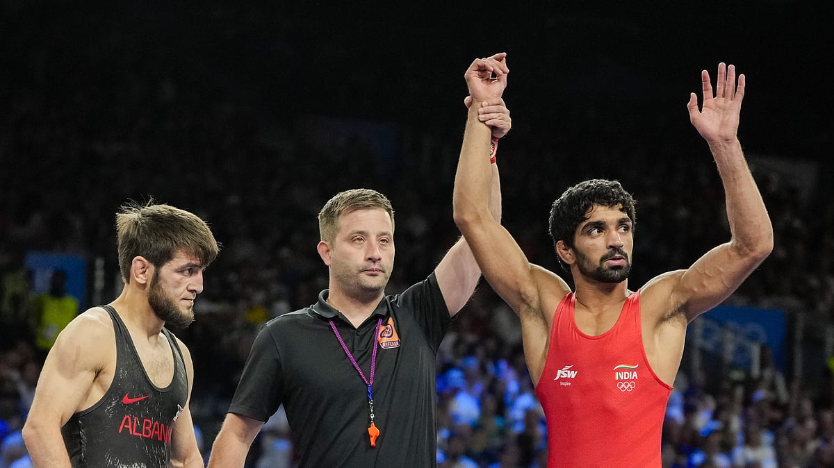 Aman Sehrawat (right) reacts after winning the men's freestyle 57kg wrestling quarter-final bout against Albania's Zelimkhan Abakarov at the Paris Olympics.  - Photo: PTI