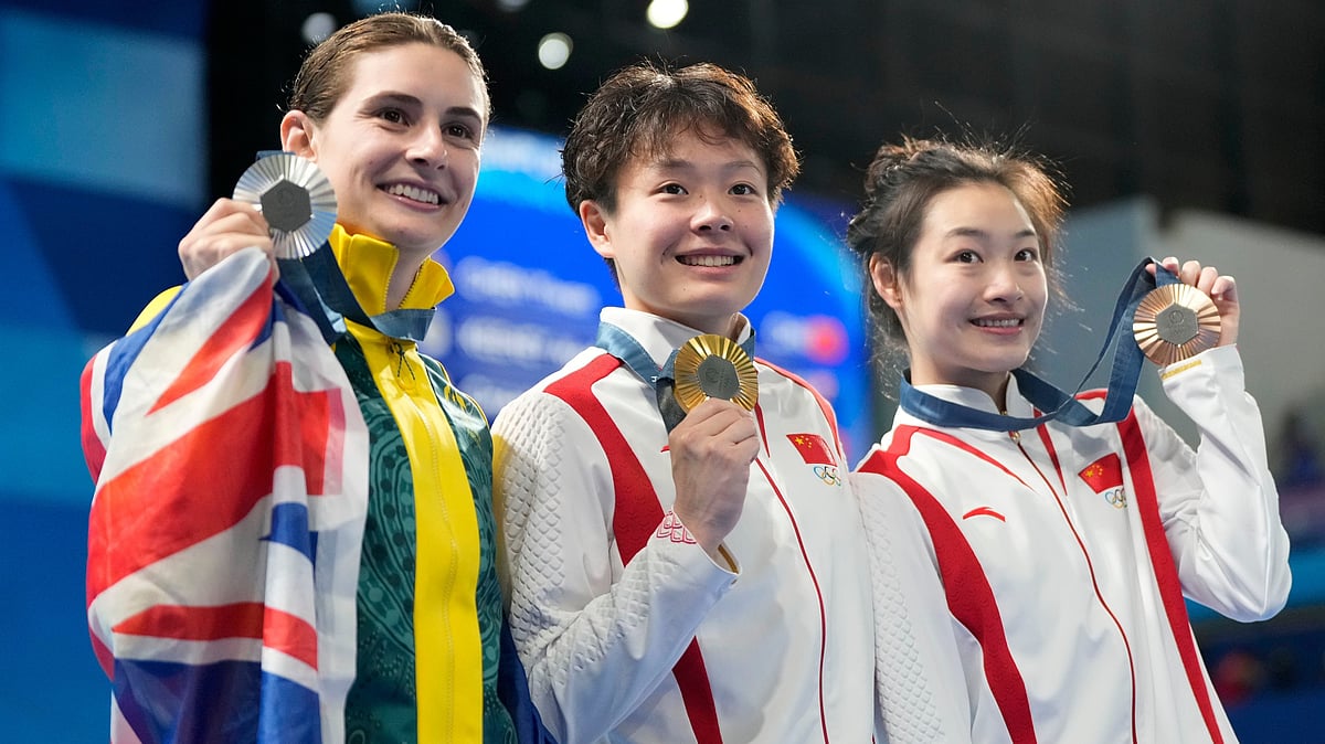 Gold medalist China's Chen Yiwen, center, China's Chang Yani, bronze medalist at right, and silver medalist Australia's Maddison Keeney, left, pose with their medals on the podium after the women's 3m springboard diving final, at the 2024 Summer Olympics, Friday, Aug. 9, 2024, in Saint-Denis, France. - AP Photo/Lee Jin-man