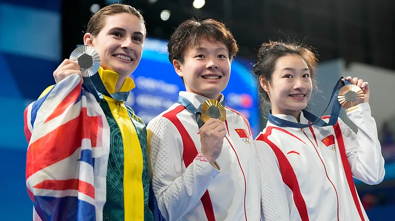 Gold medalist China's Chen Yiwen, center, China's Chang Yani, bronze medalist at right, and silver medalist Australia's Maddison Keeney, left, pose with their medals on the podium after the women's 3m springboard diving final, at the 2024 Summer Olympics, Friday, Aug. 9, 2024, in Saint-Denis, France. - AP Photo/Lee Jin-man