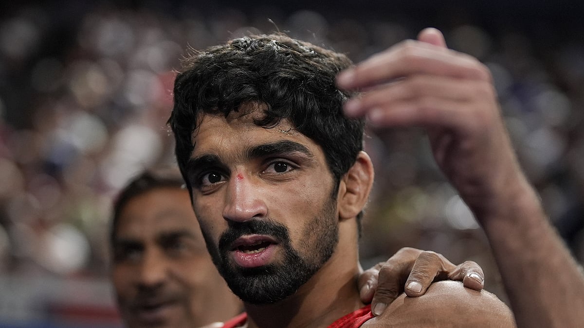 Aman Sehrawat reacts after winning his men's freestyle 57kg wrestling quarter-final bout against Albania's Zelimkhan Abakarov at the Paris Olympics. - PTI