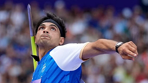 (AP Photo/Matthias Schrader) : Neeraj Chopra, of India, competes during the mens javelin throw qualification at the 2024 Summer Olympics, Tuesday, Aug. 6, 2024, in Saint-Denis, France.