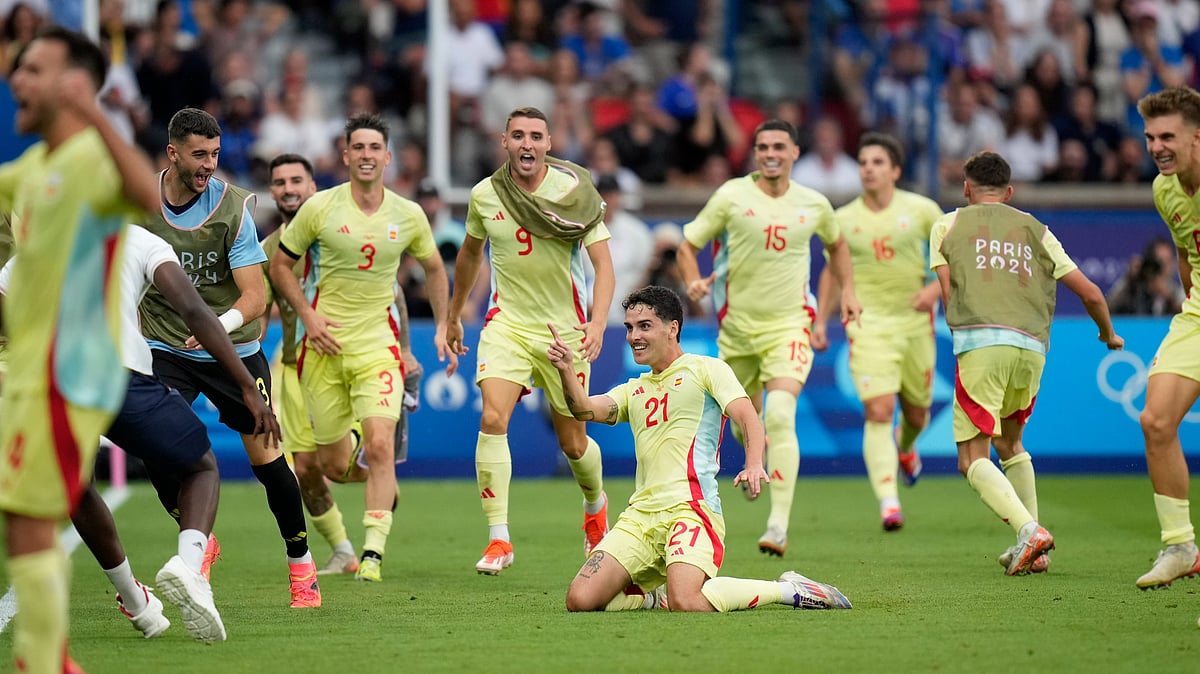 Spain celebrate after scoring against France in Olympic final - AP