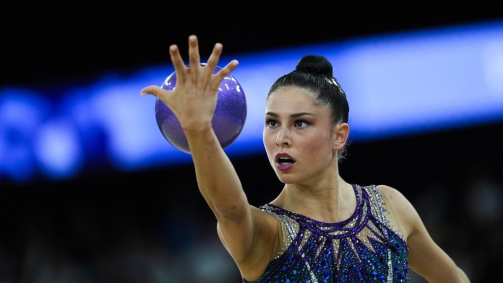 AP : Italy's Milena Baldassarri performs her ball exercise in the rhythmic gymnastics, Paris Olympics qualification round at La Chapelle Arena.