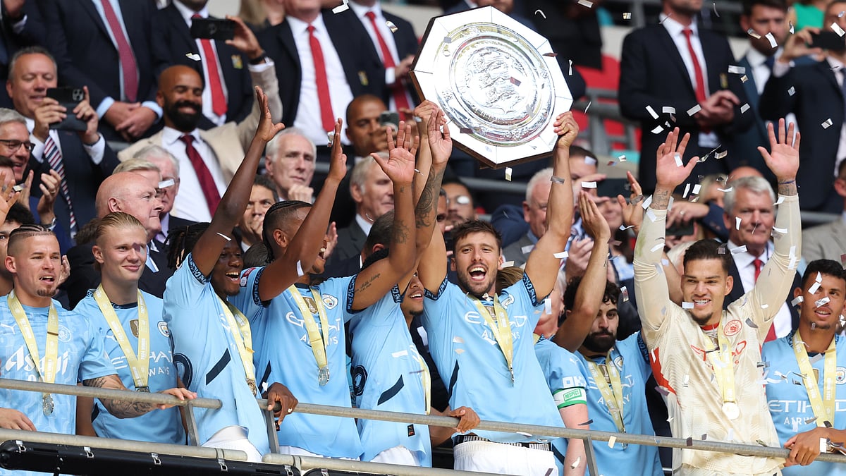 Ruben Dias lifts the Community Shield.