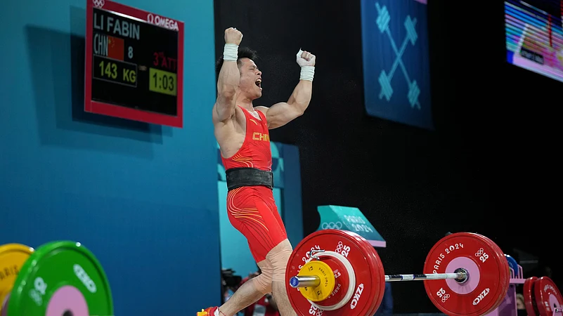 Li Fabin of China reacts as he competes during the mens 61kg. AP Photo