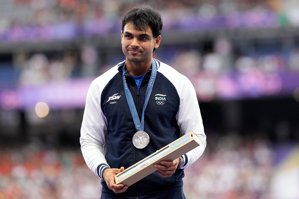 Men's javelin silver medalist, Neeraj Chopra, of India, stands on the podium at the 2024 Summer Olympics, Friday, Aug. 9, 2024, in Saint-Denis, France. ( - AP Photo/Bernat Armangue)



