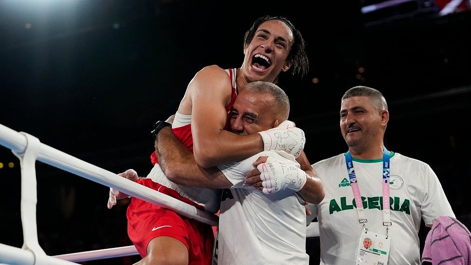 Algeria's Imane Khelif celebrates after defeating China's Yang Liu to win gold in their women's 66 kg final boxing match at the 2024 Summer Olympics, Friday, Aug. 9, 2024, in Paris, France. - AP/Ariana Cubillos