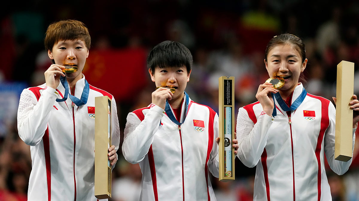 China athletes with the gold medals pose during the medal ceremony of the women's team table tennis match at the 2024 Summer Olympics. - AP Photo/Petros Giannakouris