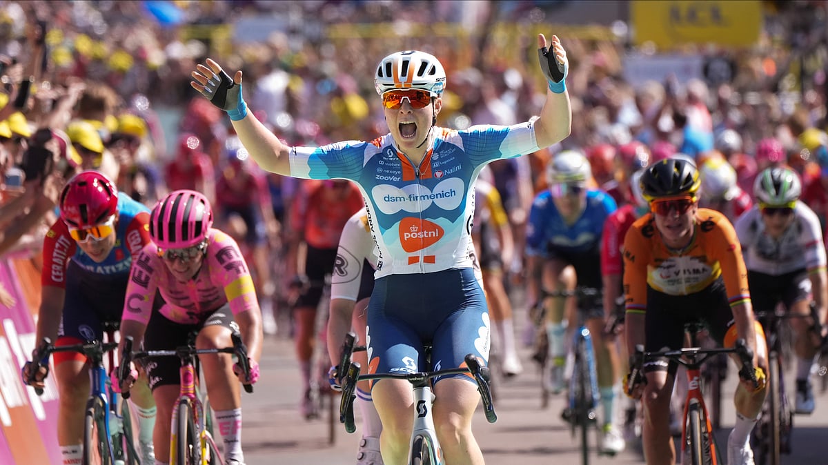 Charlotte Kool of The Netherlands celebrates as she crosses the finish line of the first stage of the Tour de France Women cycling race with start in Rotterdam and finish in The Hague, Netherlands, Monday, Aug. 12, 2024. -  AP Photo/Peter Dejong