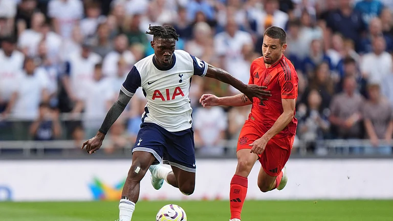 Tottenham Hotspur's Yves Bissouma, left, and Bayern Munich's Jamal Musiala challenge for the ball during the friendly soccer match between Tottenham Hotspur and Bayern Munich, at the Tottenham Hotspur Stadium - Bradley Collyer/AP