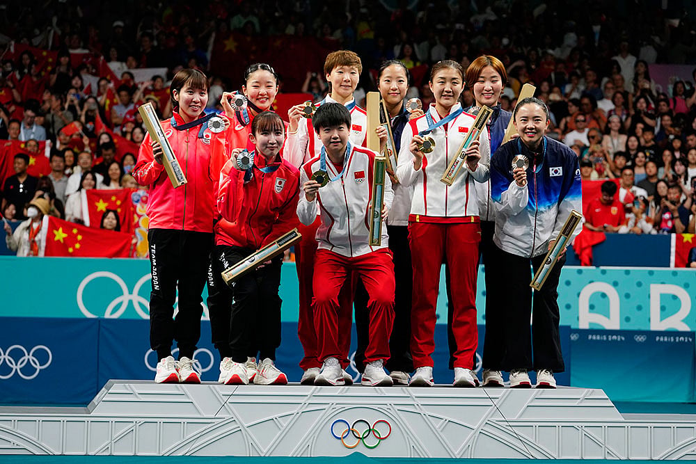 Photo: AP/Petros Giannakouris : Paris Olympics Table Tennis