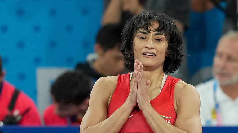 Vinesh Phogat celebrates after winning her Women's Freestyle 50kg semi-final wrestling match against Cuba's Yusneylys Guzman Lopez at the 2024 Summer Olympics. - PTI Photo/Ravi Choudhary