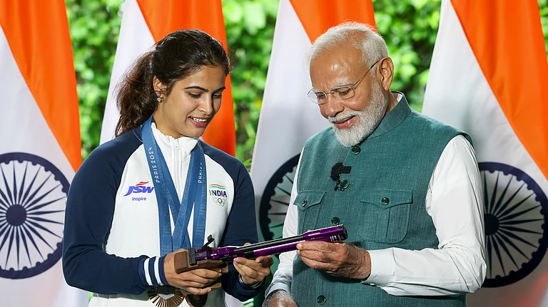 Prime Minister Narendra Modi with bronze medallist shooter Manu Bhaker during his interaction with the Indian contingent for Paris Olympics, in New Delhi, Thursday, Aug. 15, 2024. - PTI via narendramodi.in