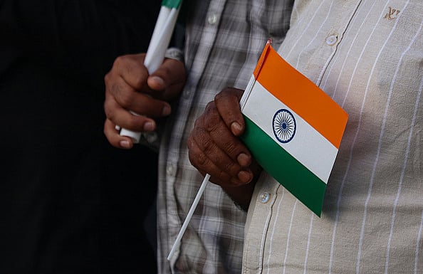 Getty Images : A man is holding the Indian flag during the Tiranga Rally ahead of Independence Day celebrations in Srinagar, Jammu and Kashmir