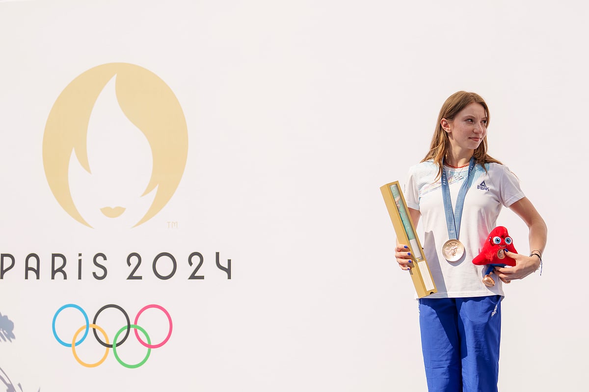 Romanian gymnast Ana Barbosu poses with the bronze medal for her women's artistic gymnastics individual floor performance at the Paris 2024 Olympics, after receiving it during a ceremony at the Romanian Olympic and Sports Committee, in Bucharest, Romania, Friday, Aug. 16, 2024. American gymnast Jordan Chiles called an arbitration panel's decision that dropped her out of the bronze medal position in the floor exercise at the Paris Olympics "unjust" and a "significant blow" in a message posted on social media Thursday.  - (AP Photo/Vadim Ghirda)