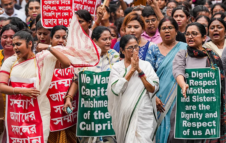 CM Mamata Banerjee leading a rally in Kolkata on Friday - PTI