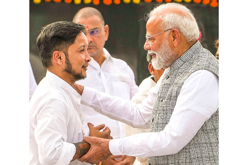 PM Narendra Modi meets with singer Pawandeep Rajan at the Sadaiv Atal in Delhi