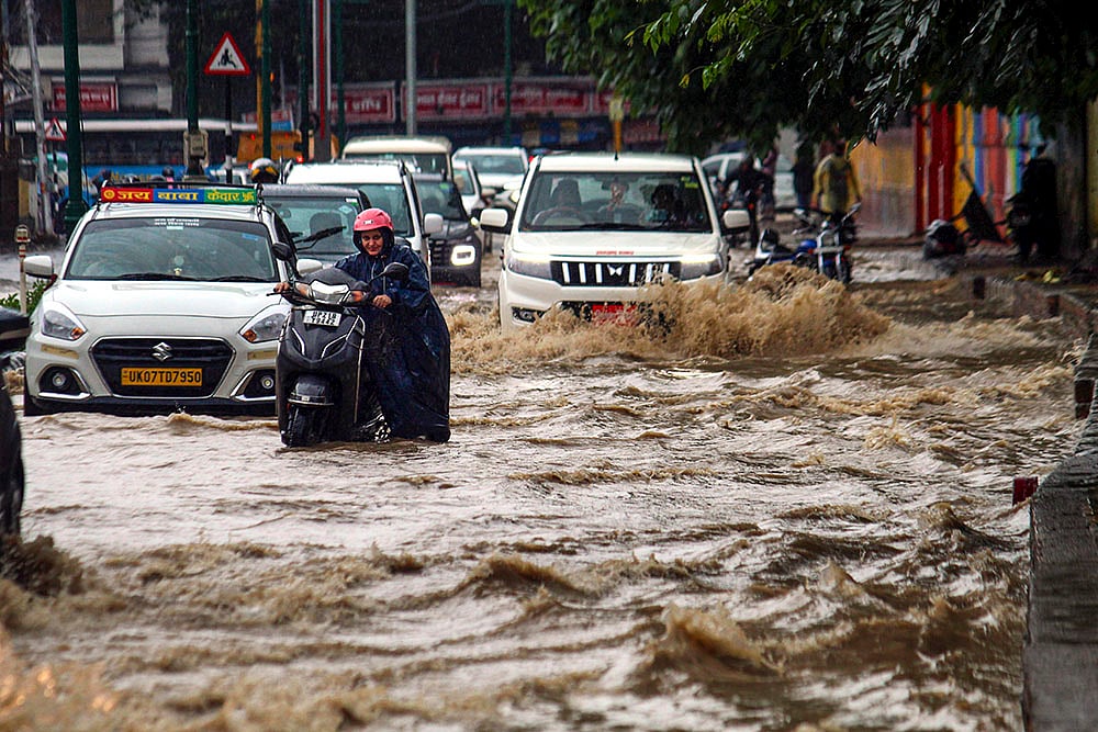 waterlogged road after rains, in Dehradun
