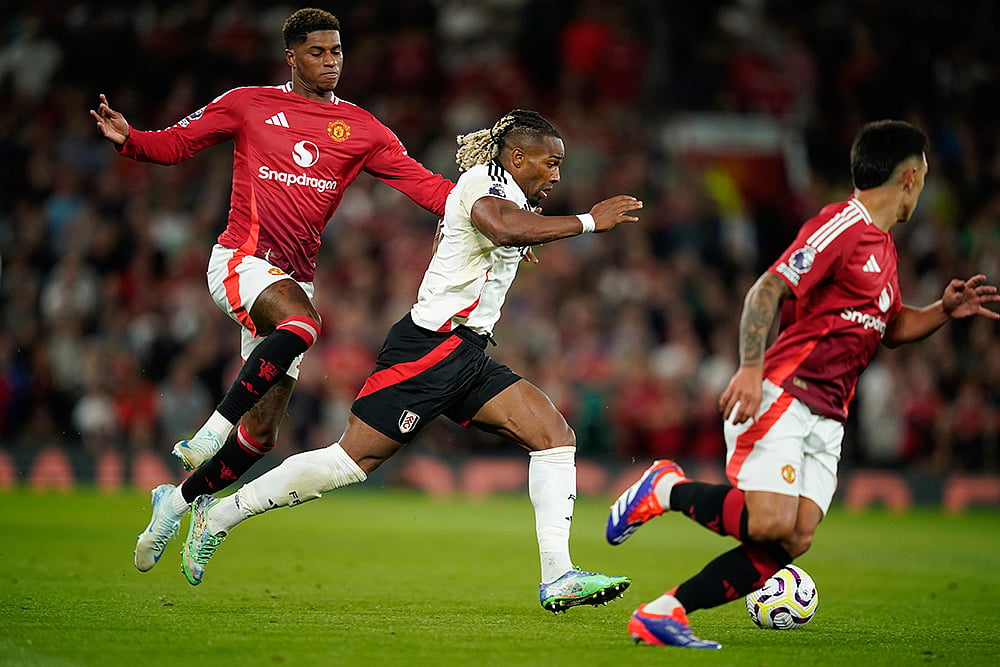 English Premier League 2024-25: Manchester United Vs Fulham_Marcus Rashford challenges Adama Traore