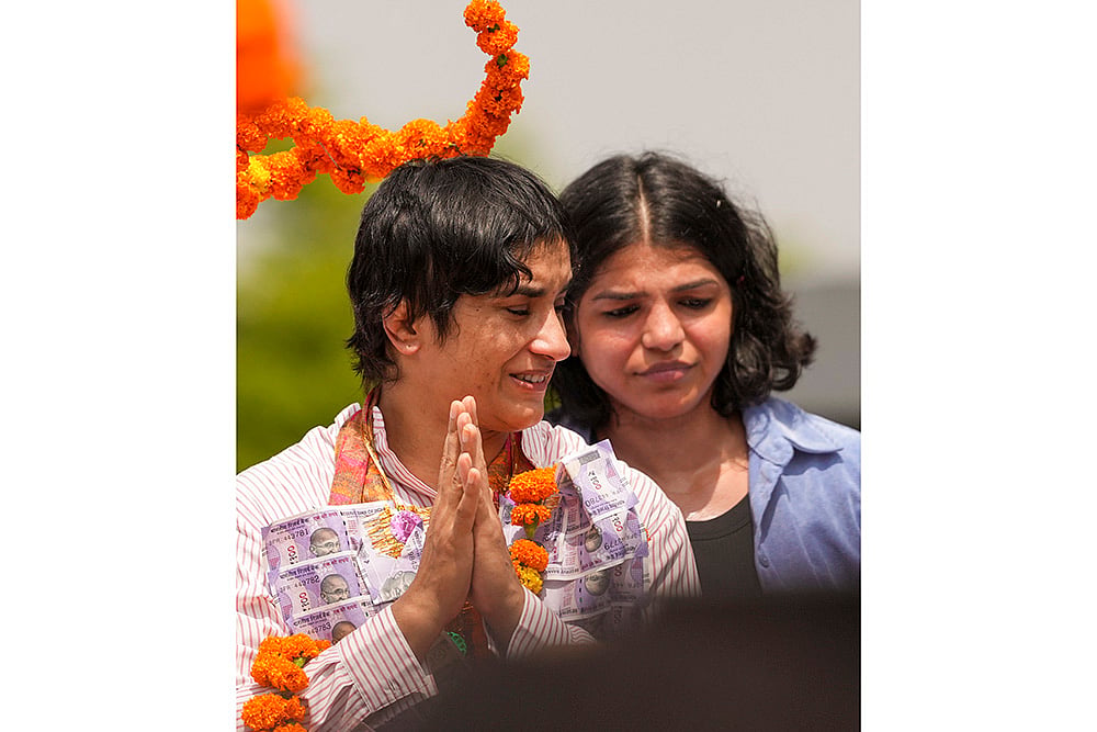 Wrestler Vinesh Phogat with Sakshi Malik at IGI airport in Delhi after Paris Olympics heartbreak