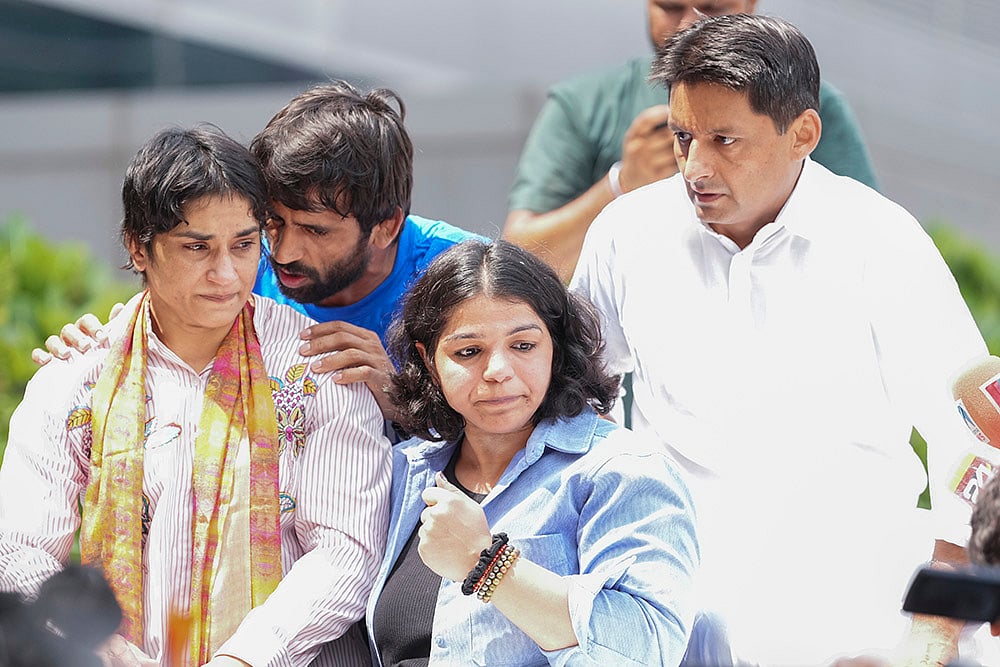 Wrestler Vinesh Phogat, Bajrang Punia, Sakshi Malik at IGI airport after Paris Olympics heartbreak