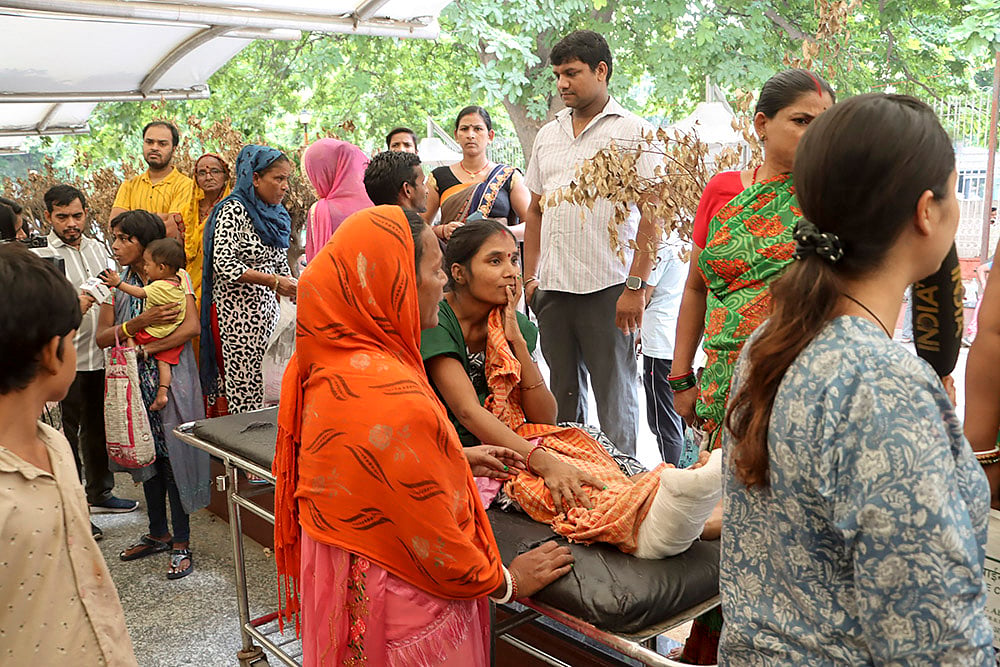 A patient being shifted as doctors and staff of RML Hospital protest in New Delhi 