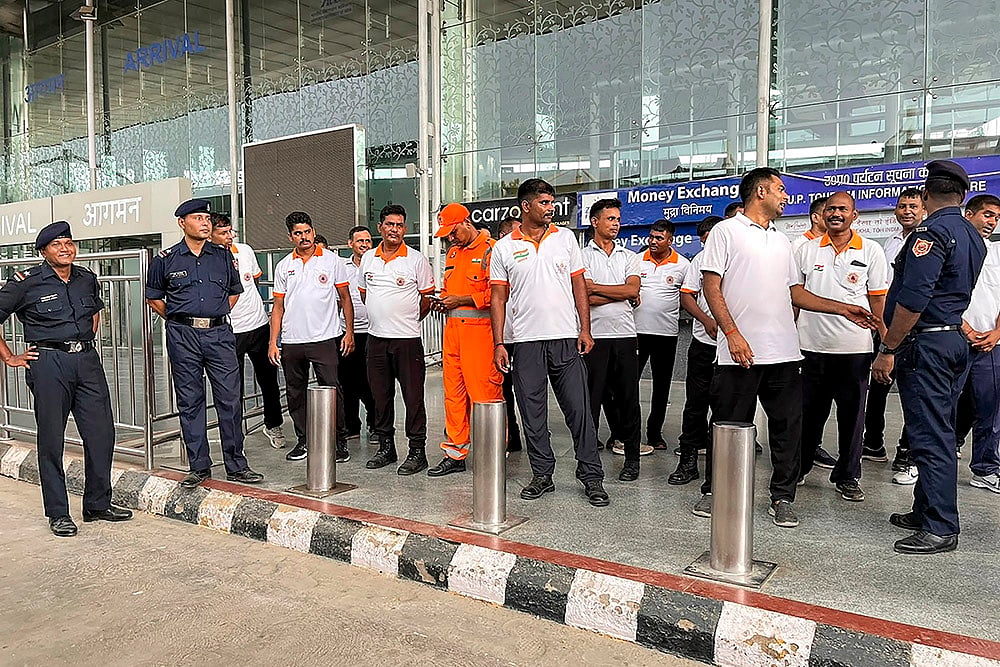Staffers outside Lucknow Airport after alleged leakage of fluorine gas that caused chaos in area