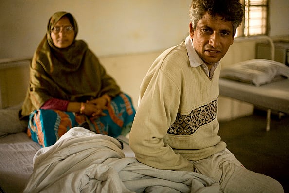 (Photo by In Pictures Ltd./Corbis via Getty Images)
 : A mentally ill man and his wife